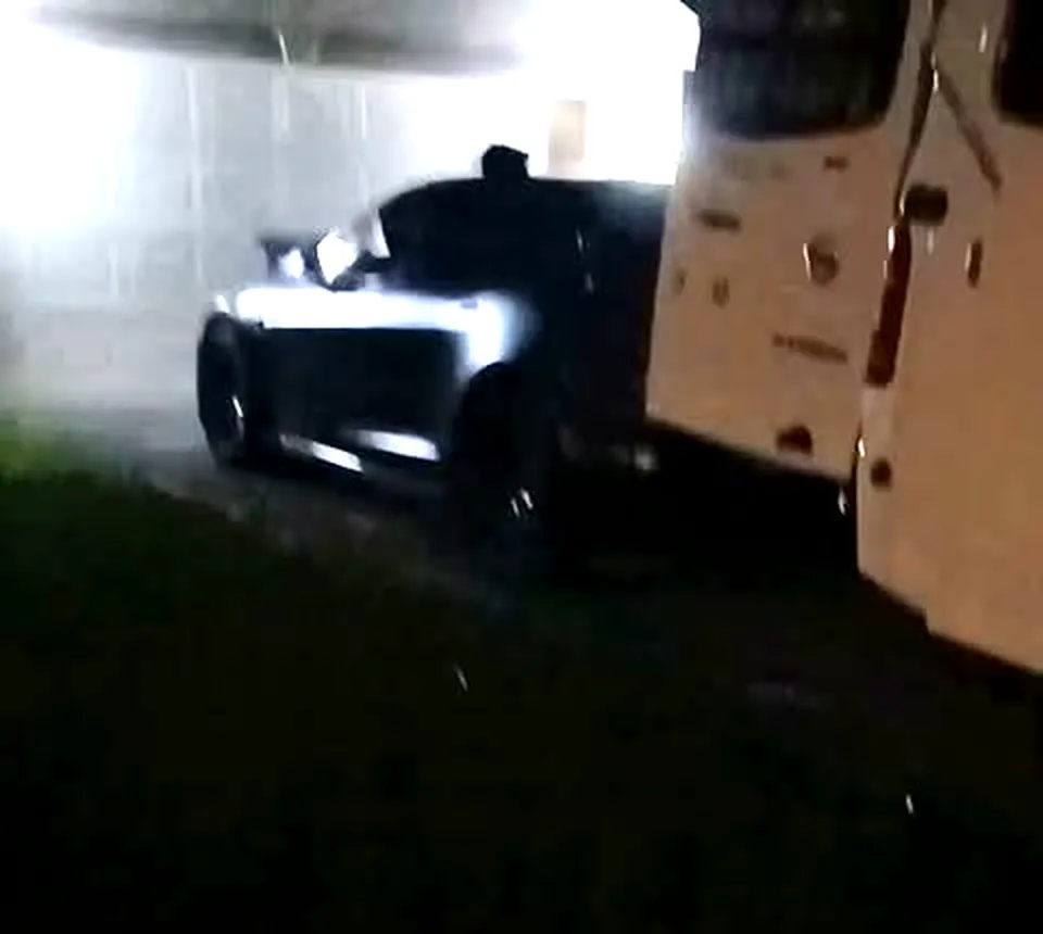 DJR Roadside service van beside a Tesla during a night emergency charging call in Port St Lucie